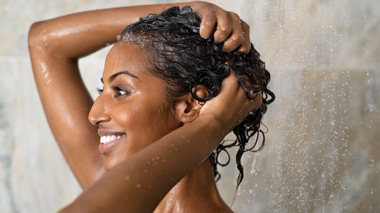 woman washing curly hair