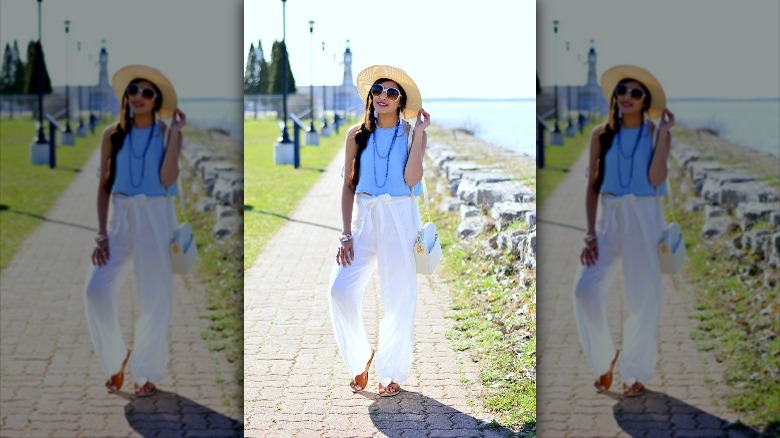 woman wearing blue crop top and loose pants