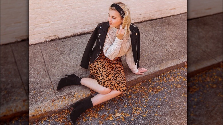 Woman poses wearing black headband 