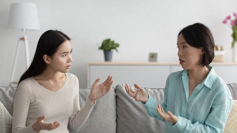 Older woman and younger woman having serious conversation