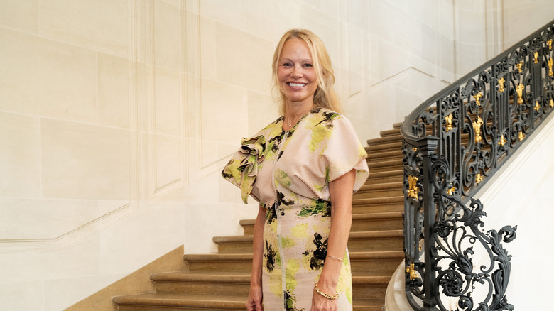 Pamela Anderson fresh faced on stairs