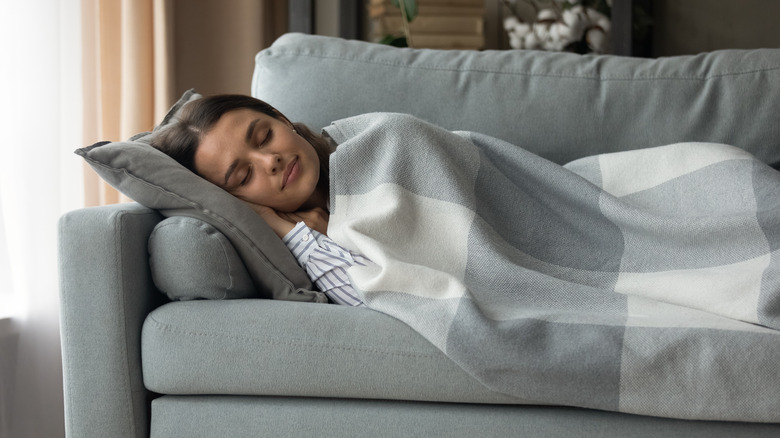 Woman sleeping on couch