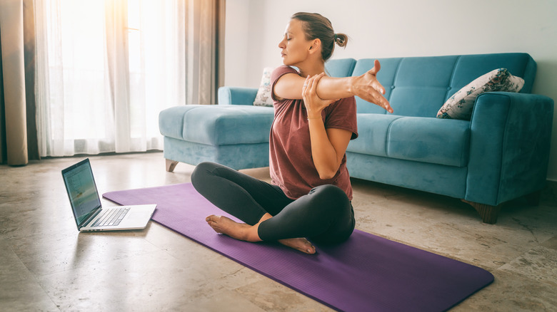 Woman doing yoga at home