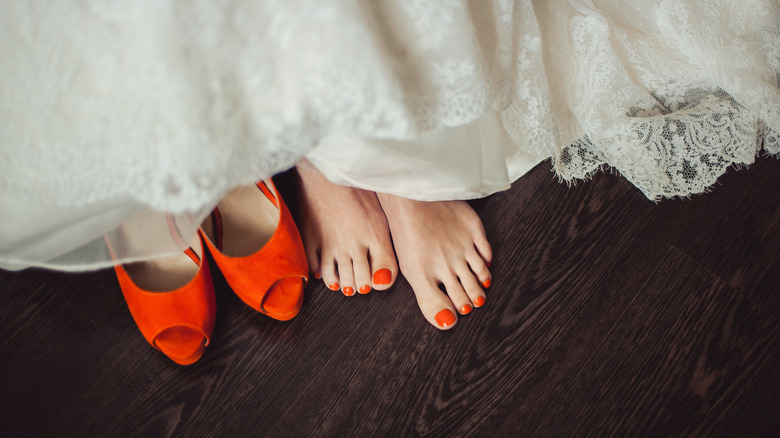 Orange bridal shoes and pedicure