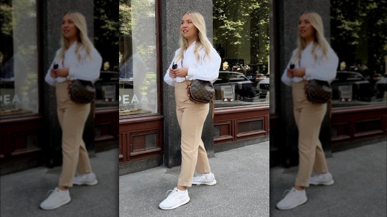 Woman wearing workwear with sneakers 