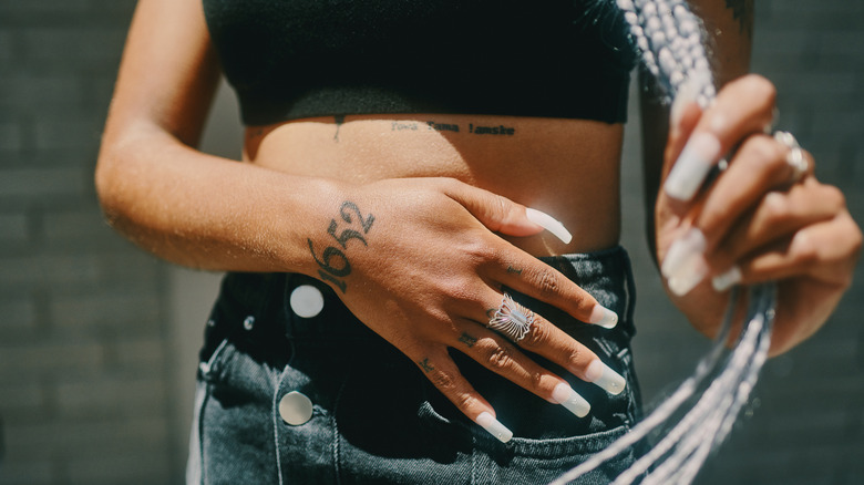 woman with hand tattoos