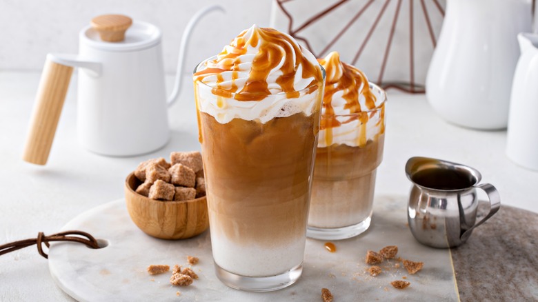 two iced coffees with whipped cream