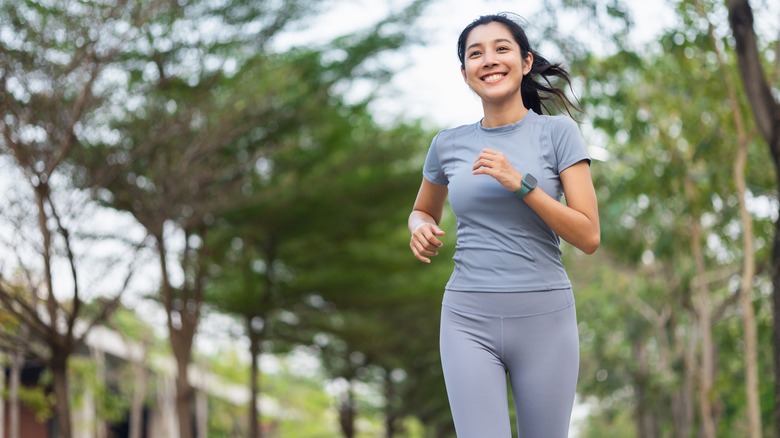 smiling woman jogging
