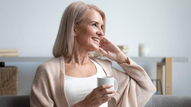 smiling woman with mug