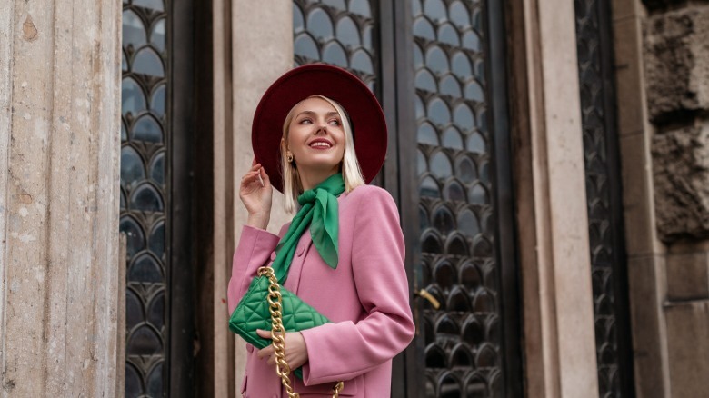 woman wearing a necktie as neck scarf