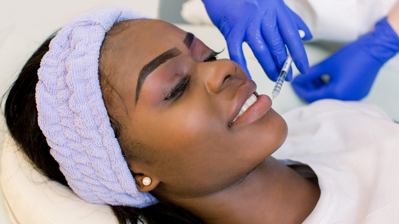 woman getting lip injections