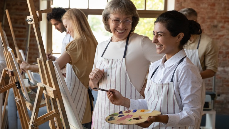 People painting at easels