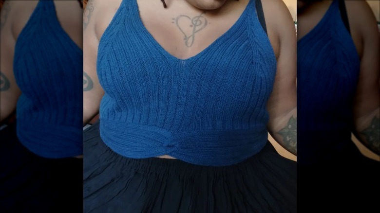 Woman wearing blue ribbed knit tank