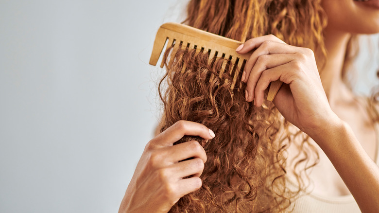 woman combing hair