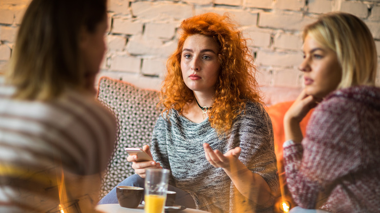 Female friends having serious conversation 