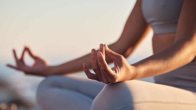 Person sitting and meditating