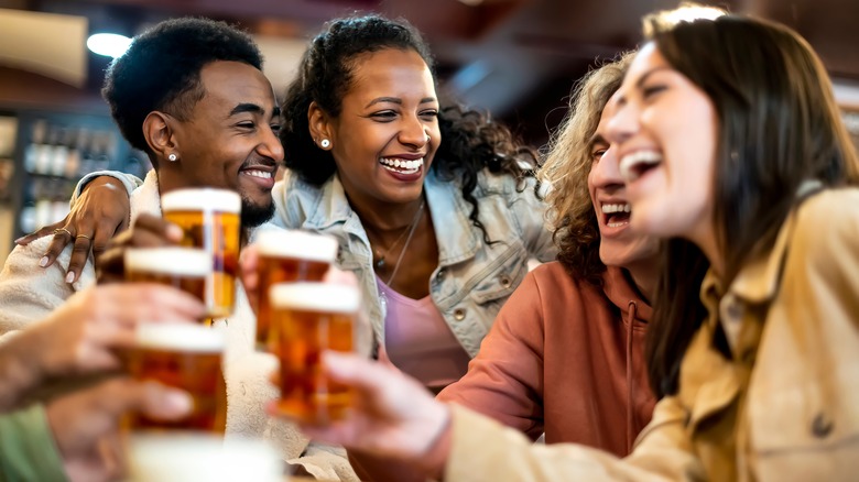 Friends drinking beer at bar