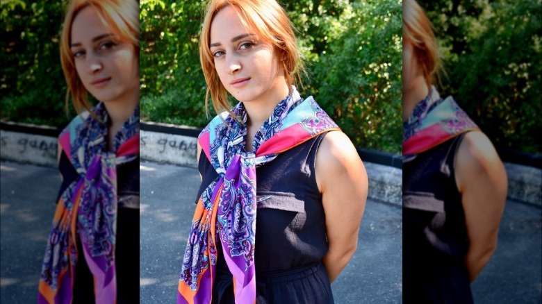 Woman wearing silk scarf