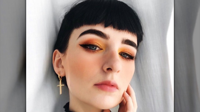 woman wearing orange makeup