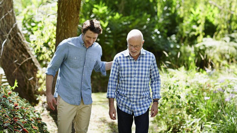 Two men walking outside