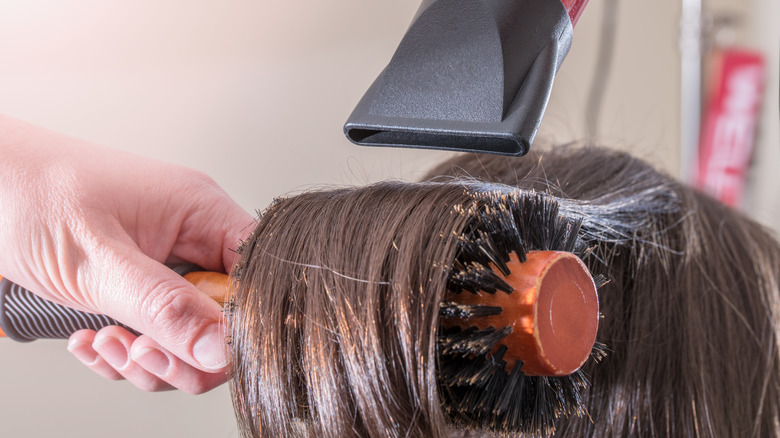 Styling hair with round brush