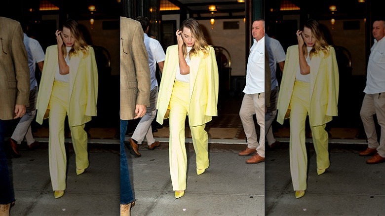 margot robbie wearing yellow suit