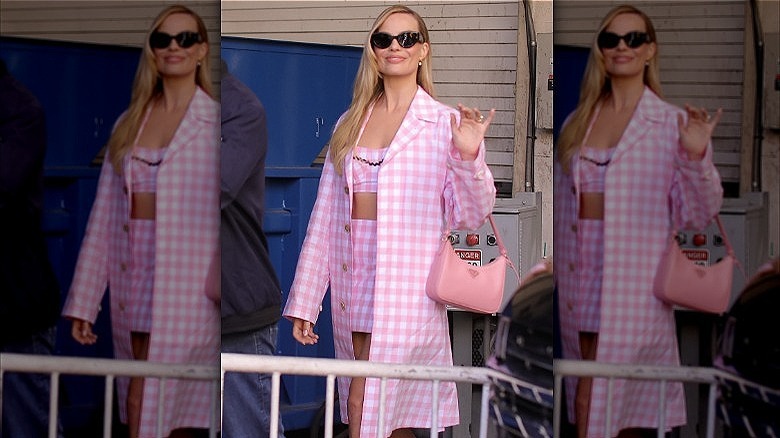 margot robbie wearing pink checkered outfit