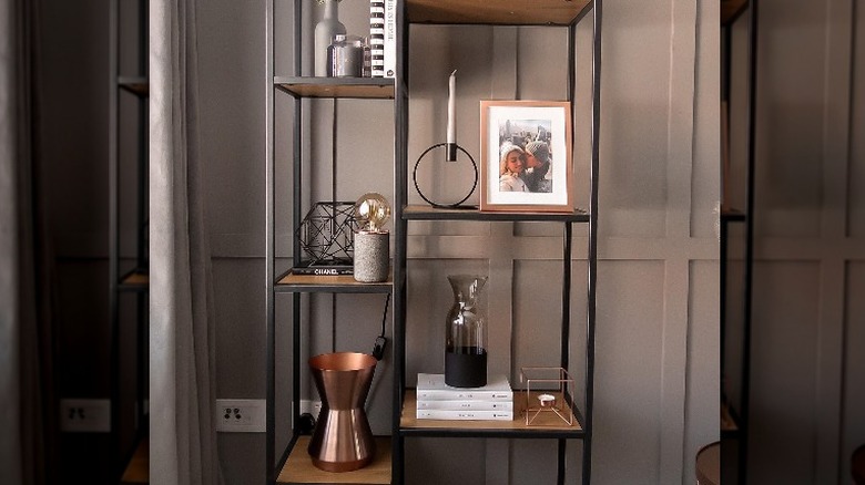 Sophisticated bookshelf with vessels