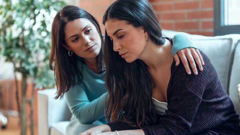 Two women supporting each other 