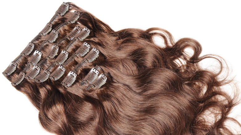 Clip-in brown curly hair extensions