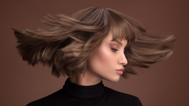 woman shaking her hair