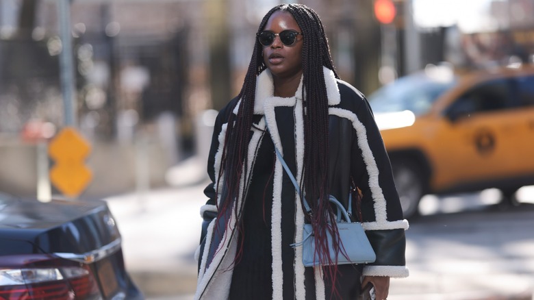 woman wearing shearling coat