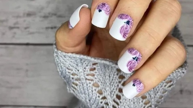 white and purple flowers nail art
