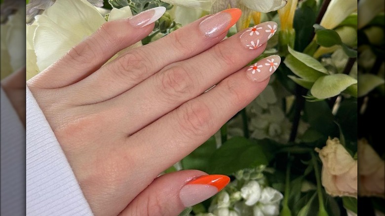 orange french tip floral manicure