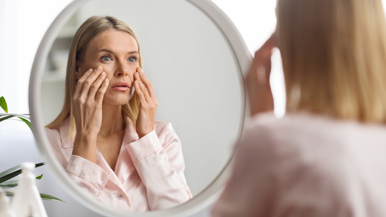 Woman looking in the mirror