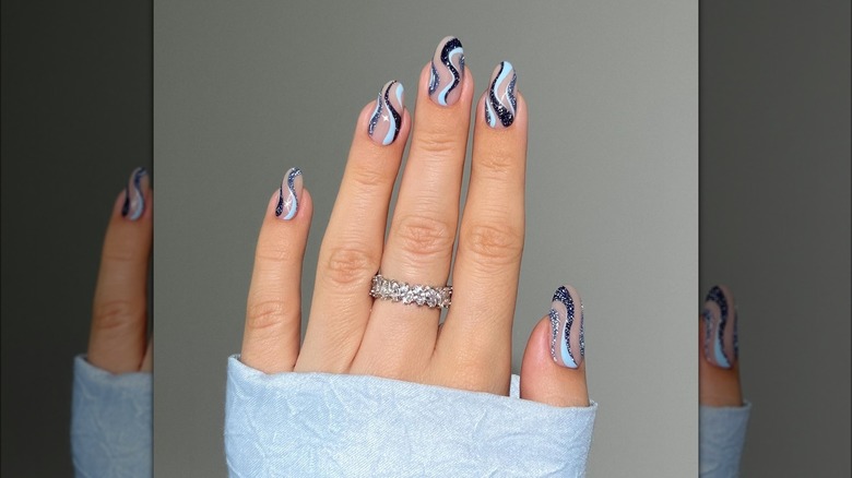Blue swirls nail art