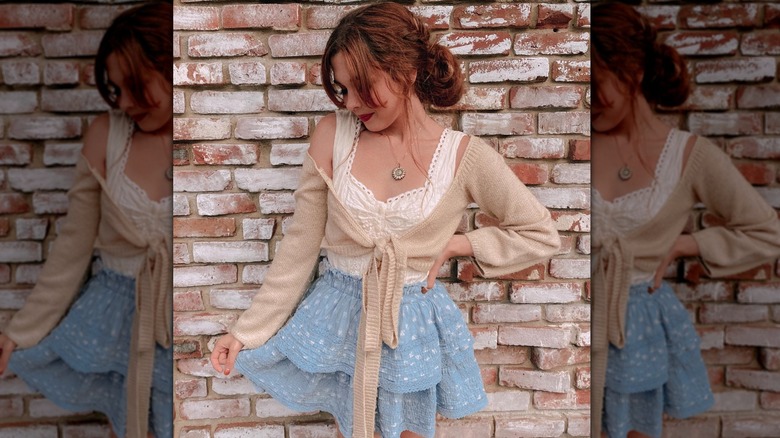 woman and brick wall