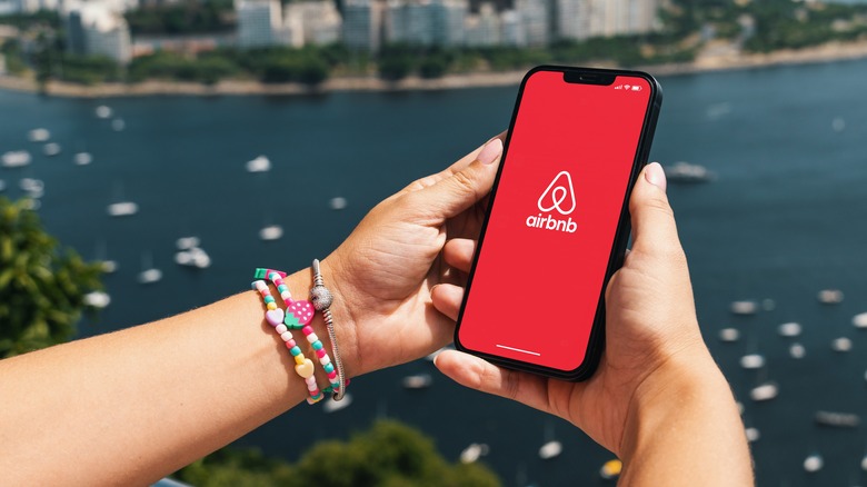 Woman uses Airbnb app