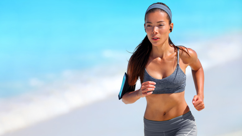 woman exercising with headphones