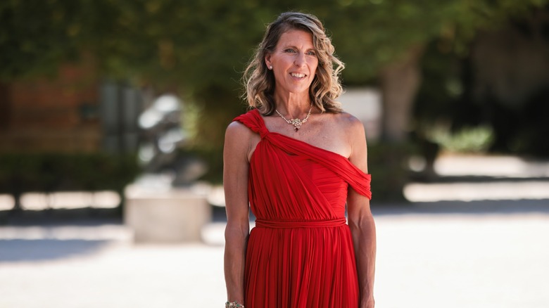 woman wearing one-shoulder dress