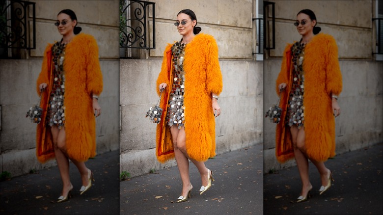 woman wearing textured dress and coat