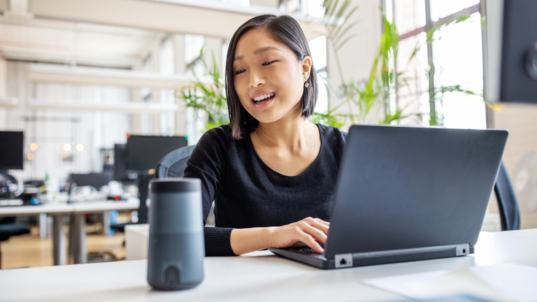 Woman speaks to Alexa-enabled device 