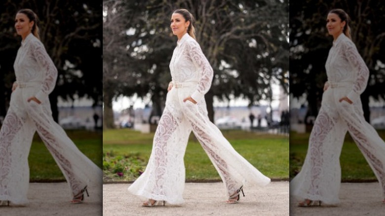 woman wearing a lace white jumpsuit