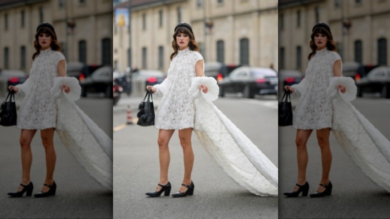 woman wearing a white lace minidress