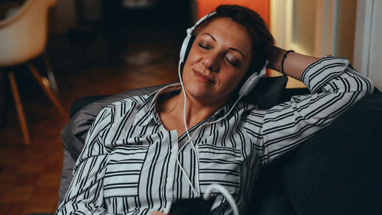 woman with headphones at home