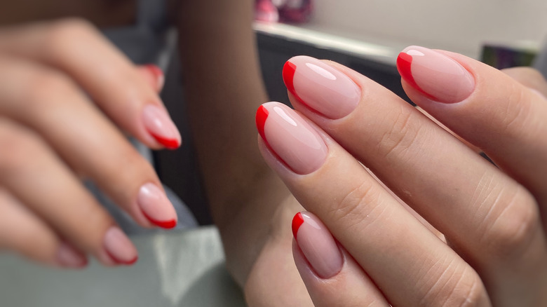 woman's colorful french manicure