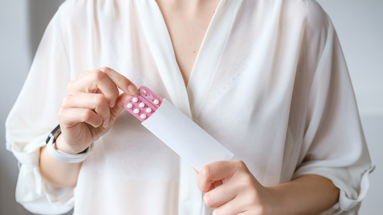 female taking pills