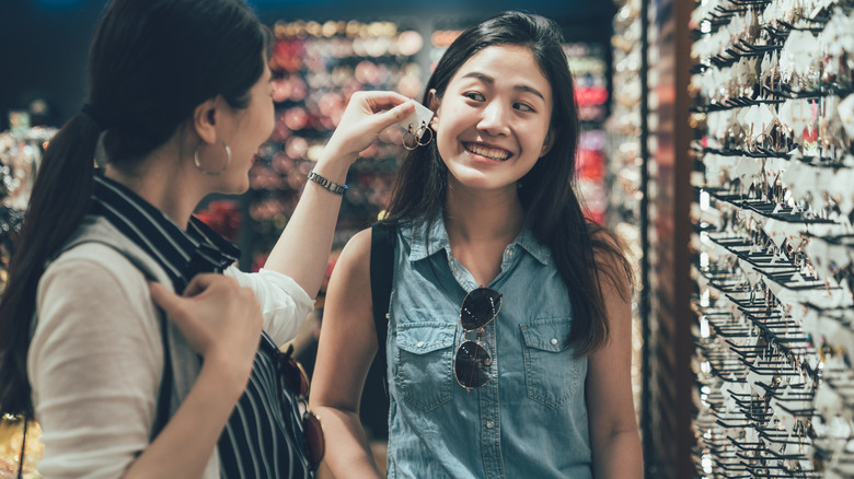 women shopping for earrings