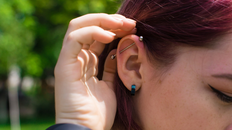 woman with multiple ear piercings