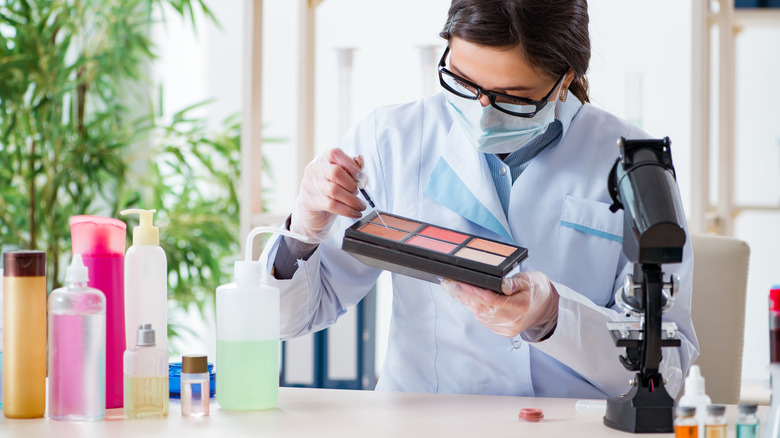 Scientist testing makeup pallette